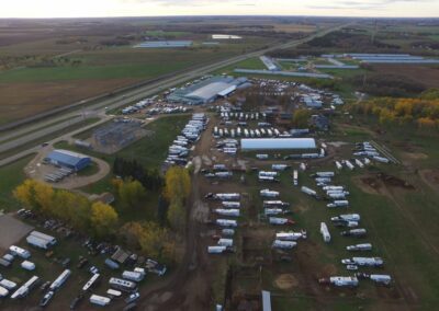 A sprawling aerial view of a massive RV park, resembling an arena in its vastness.